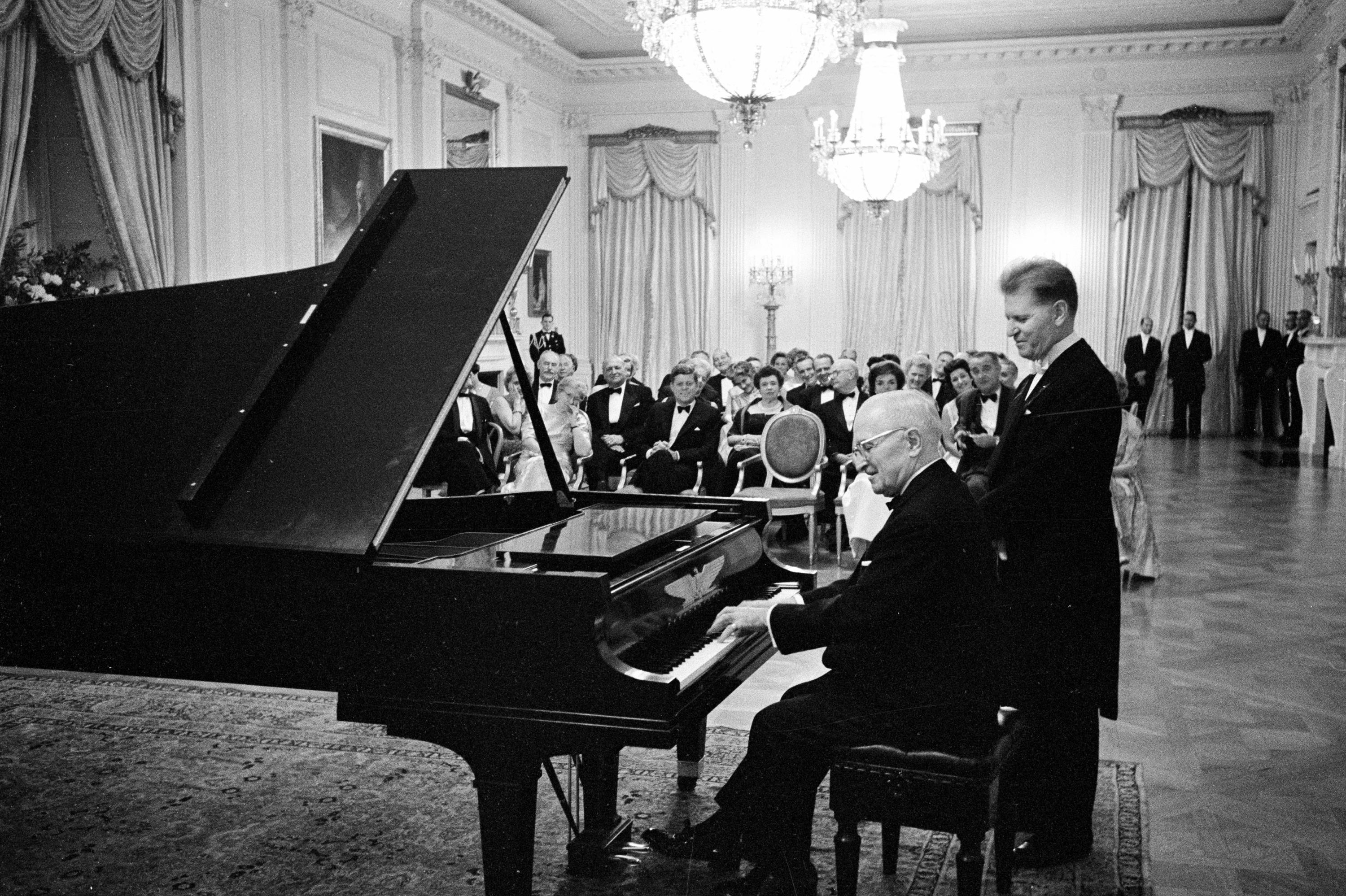 Harry Truman plays the piano at the White House for John F. Kennedy